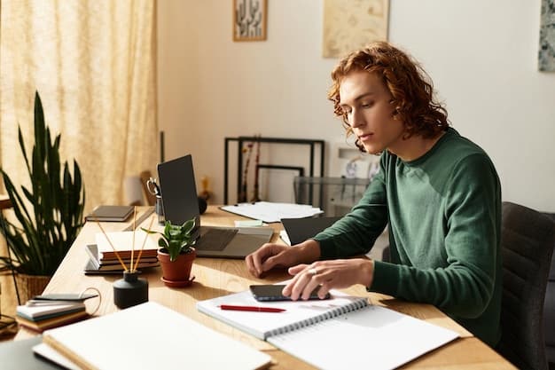 A person sitting at a desk, reviewing financial documents and using a calculator, highlighting the importance of financial planning and understanding income-driven repayment options for student loans.