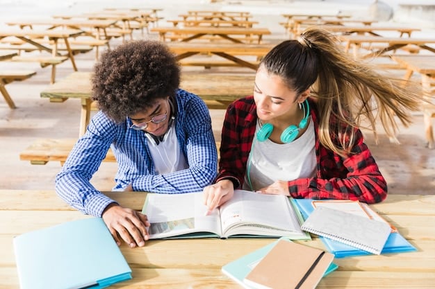 Two students, one American and one from a local university, working together on a project in a modern library in Barcelona, Spain, showcasing collaboration and cross-cultural learning.