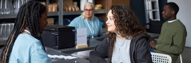 A professor lecturing a diverse group of graduate students in a high-tech classroom, highlighting the expert instruction and collaborative learning environment of a master's program.