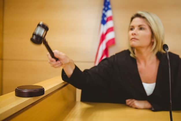 A close-up of a gavel striking a sound block in a courtroom, with a blurred American flag in the background, symbolizing the legal consequences and justice system involved in prosecuting insider trading cases.