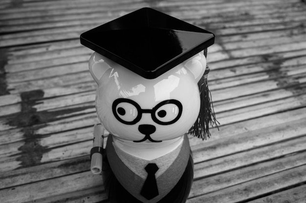 A graduate in cap and gown, symbolizing the completion of education, with a visual representation of a student loan interest deduction superimposed on the image. The visual emphasizes the financial benefit of deducting student loan interest from taxes.