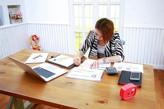 A person filling out Form 2441 on a desk with a calculator, receipts, and other tax-related documents spread around.