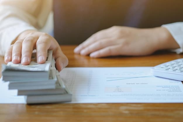 A close-up shot of hands organizing and filing various documents related to student loans, including loan statements, tax returns, and employment verification forms.