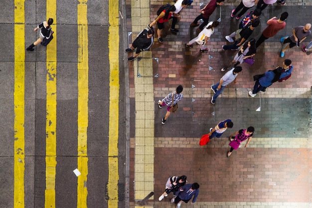 An aerial view of a bustling university campus during a weekday, with students walking to classes and engaging in outdoor activities. The image should convey a sense of vibrancy and purpose, emphasizing the role of higher education in shaping future leaders.