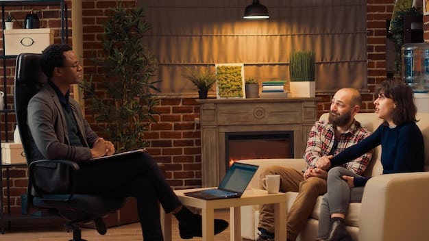 A school psychologist talking to a student in a brightly lit office, creating a safe and welcoming environment. The student is smiling, indicating a positive interaction and trust between them. Bookshelves and educational posters are visible in the background.