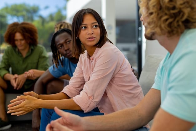 A group of students participating in a mental health awareness workshop. They are engaged in a group activity, discussing mental health topics with enthusiasm and openness. Posters promoting mental health awareness are displayed on the walls.