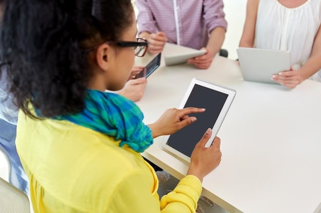 A teacher providing one-on-one instruction to a student, using a tablet for interactive learning. The student appears engaged and is receiving focused attention.