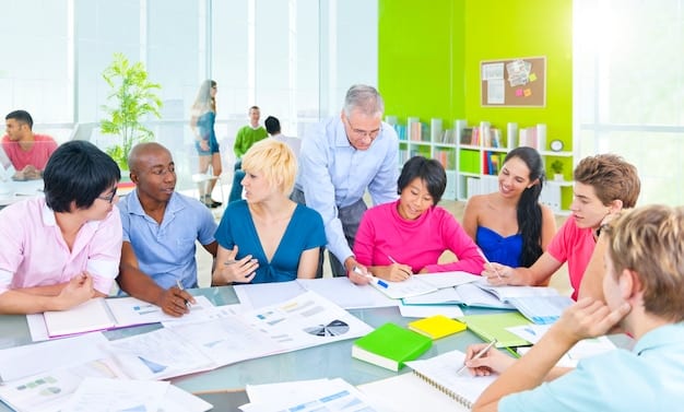 A photo of a diverse group of teachers participating in a professional development workshop. They are actively engaged in discussions and hands-on activities, illustrating the collaborative and practical nature of teacher training.