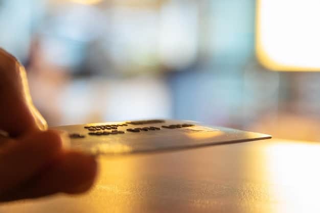 A person holding a credit card, with a blurred background showing various bills and financial statements. The focus is on responsible credit card usage and avoiding debt accumulation.